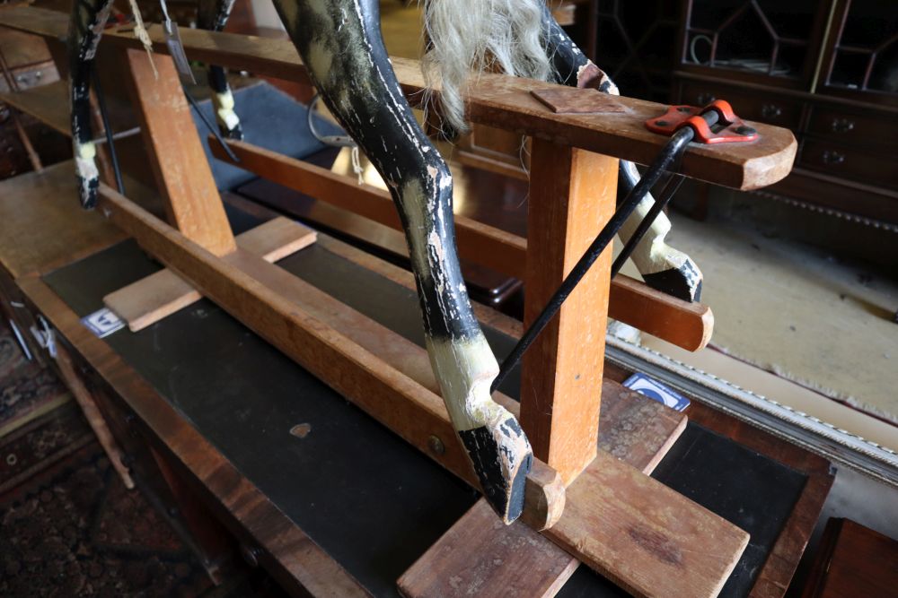 An Ayres-type rocking horse on wooden frame, length 130cm height 108cm (a.f.)